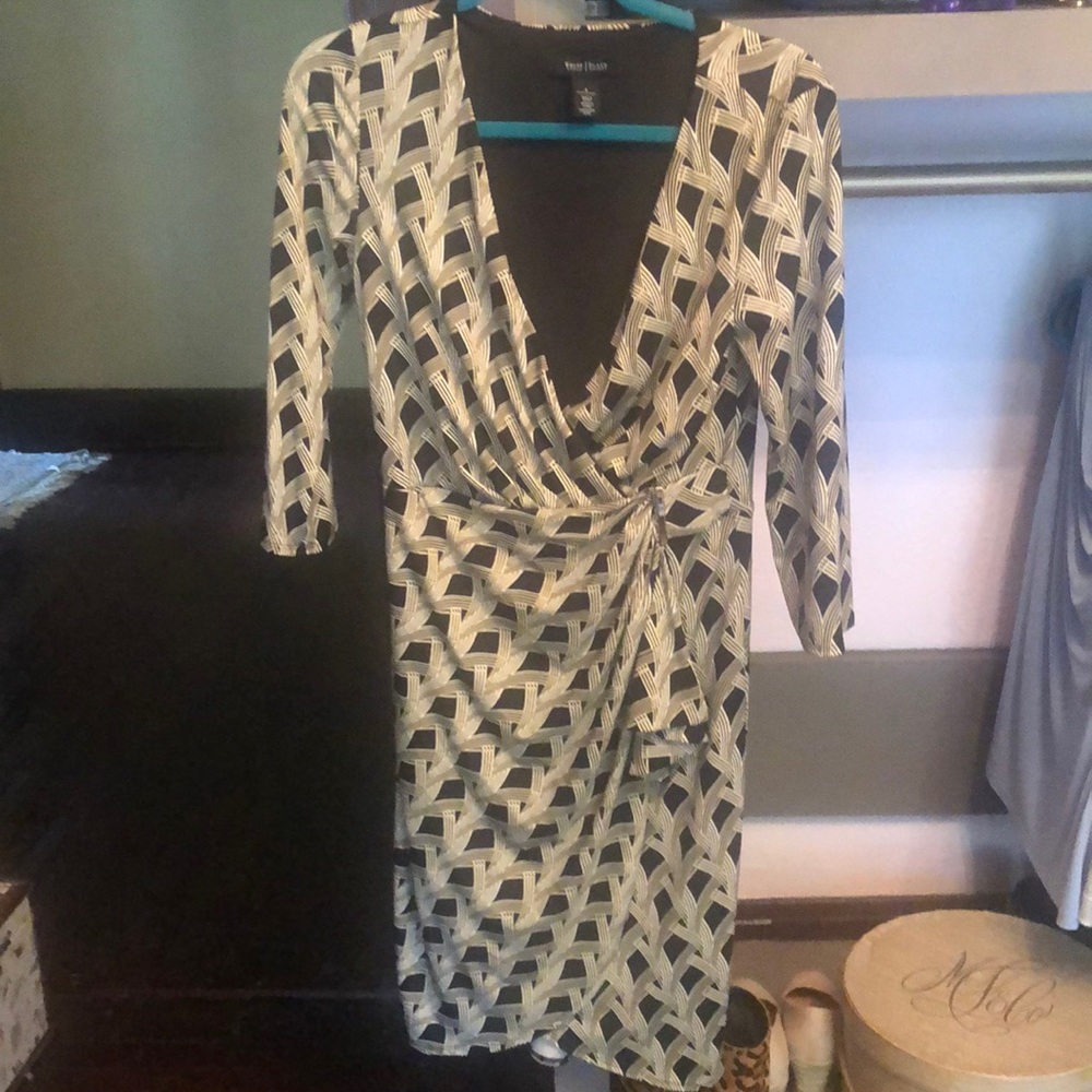 Printed black faux wrap dress, belted.